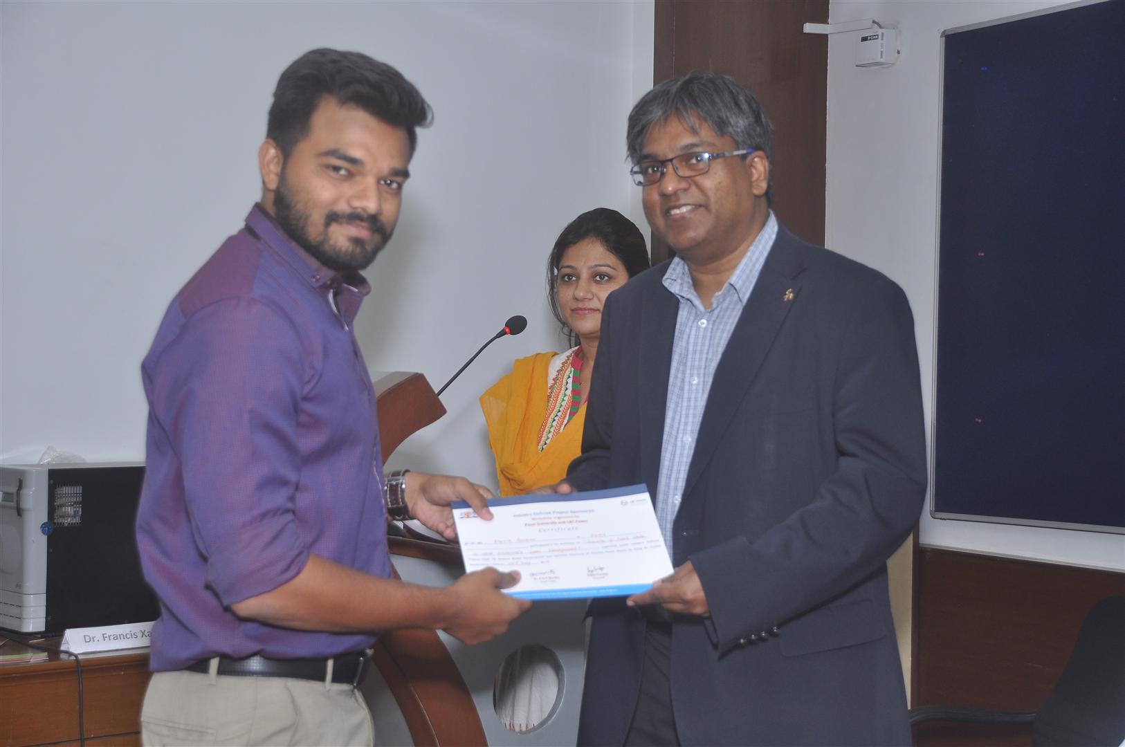 3. WORKSHOP ON SCARCITY OF FRESH WATER AND SUSTAINABLE WATER-Dr.Ravi S Silva distributing certificate to delaegate